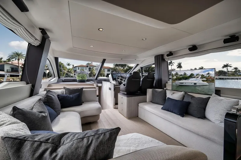 Slide: The Image of Luxurious interior of 2019 Azimut 55 yacht with plush seating and scenic views. - 100