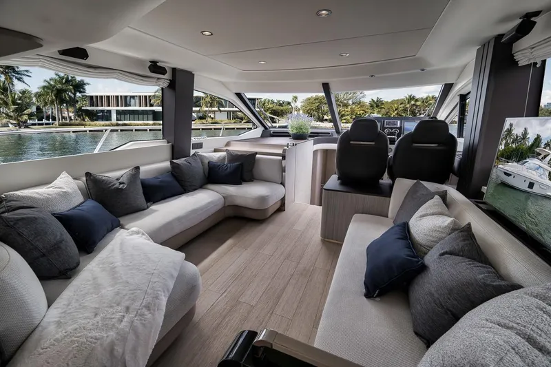 Slide: The Image of Luxurious interior of 2019 Azimut 55 yacht with plush seating and scenic water views. - 102