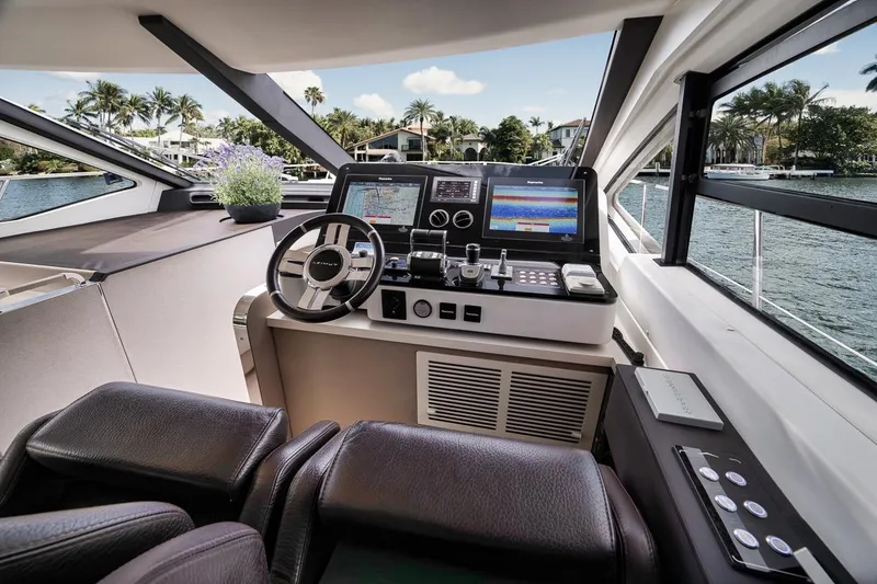 Slide: The Image of Luxurious 2019 Azimut 55 yacht helm with modern navigation systems and waterfront view. - 104