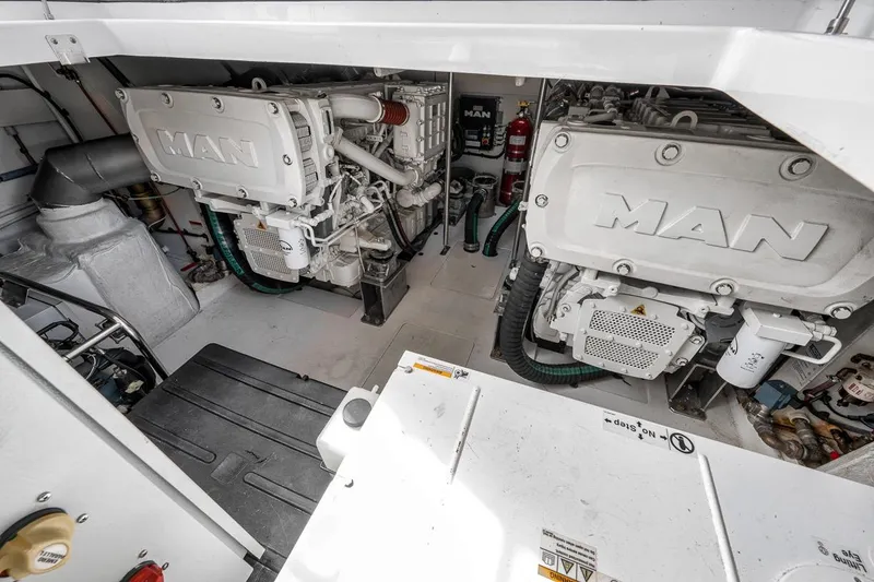 Slide: The Image of Engine room of a 2019 Azimut 55 yacht featuring dual MAN engines. - 109