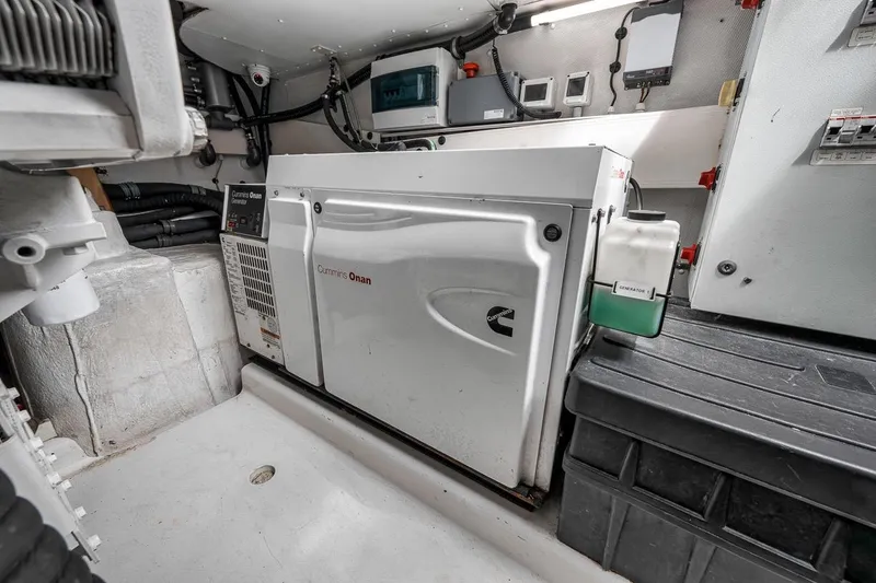 Slide: The Image of Engine room of 2019 Azimut 55 yacht featuring Cummins Onan generator. - 112