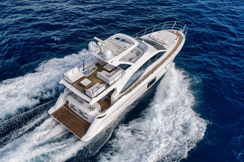 Slide: The Image of Luxurious 2019 Azimut 55 yacht cruising on open blue sea. - 14