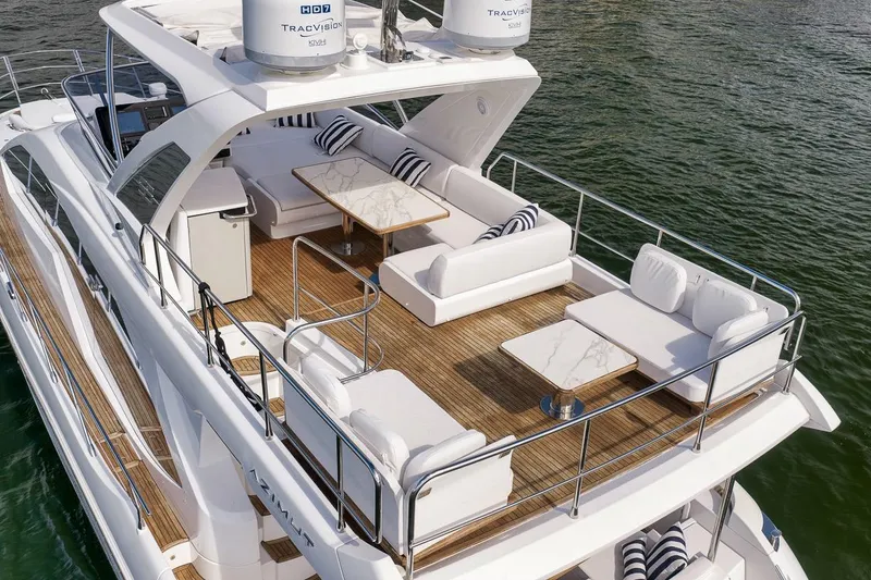 Slide: The Image of Luxurious 2019 Azimut 55 yacht with elegant outdoor seating on the deck. - 17