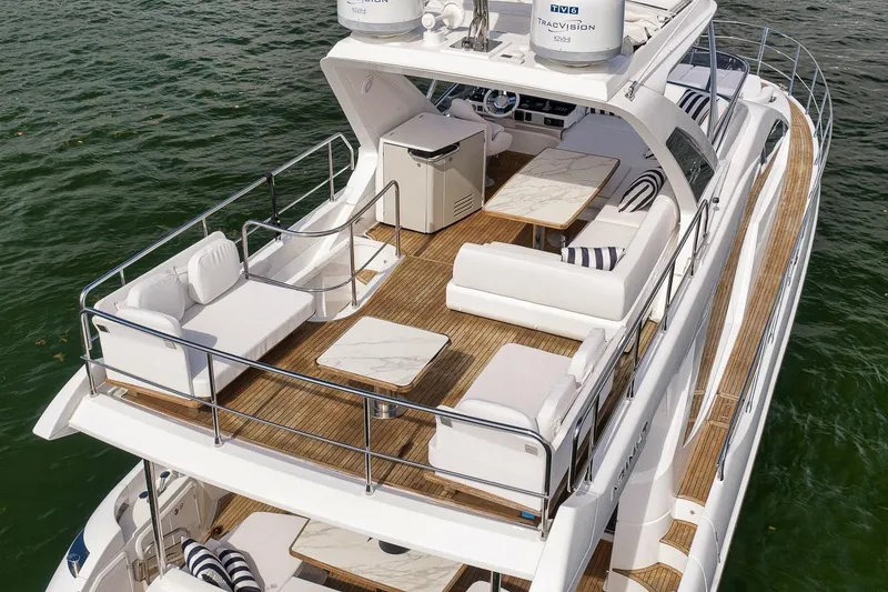 Slide: The Image of Luxurious 2019 Azimut 55 yacht with spacious deck and elegant seating on the water. - 21