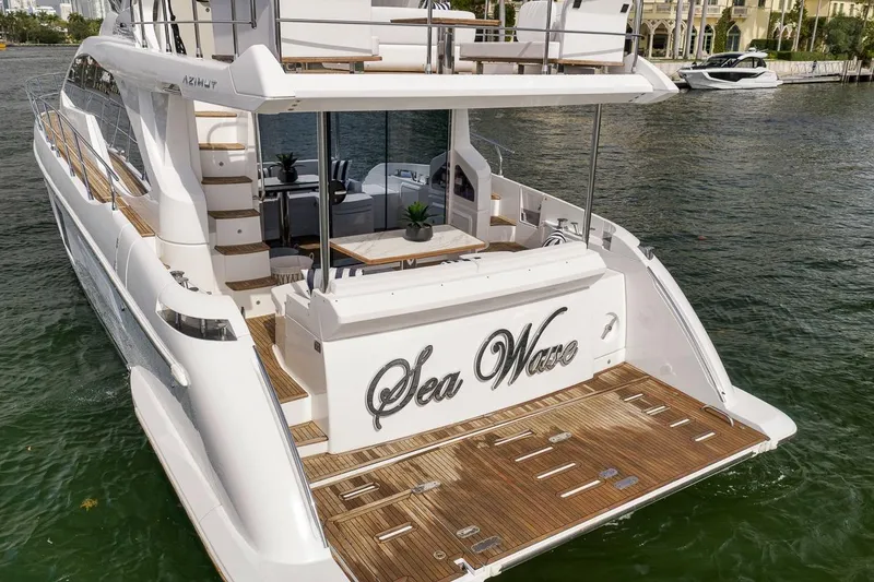 Slide: The Image of 2019 Azimut 55 yacht "Sea Wave" with elegant deck and seating area. - 26