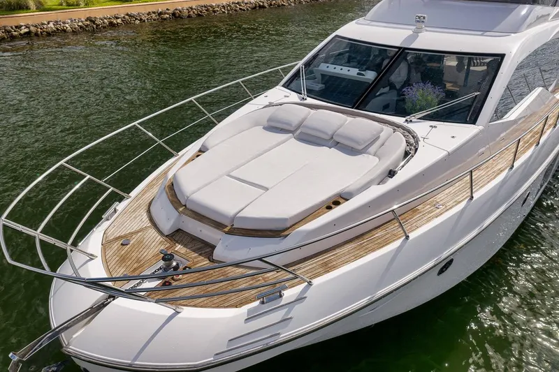 Slide: The Image of Luxurious 2019 Azimut 55 yacht with spacious sunbathing deck on calm waters. - 32