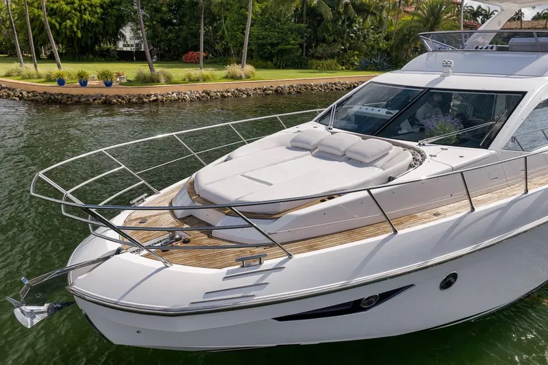 Slide: The Image of Luxurious 2019 Azimut 55 yacht docked by lush tropical shoreline. - 33