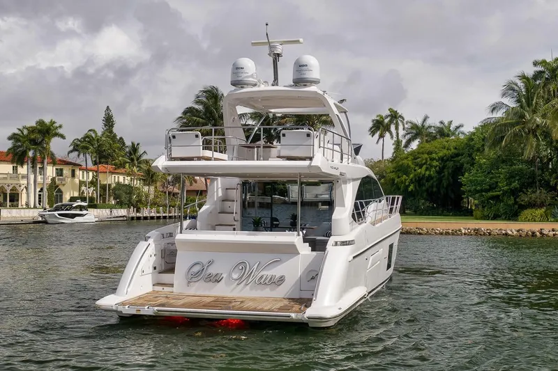 Slide: The Image of Luxury 2019 Azimut 55 yacht on scenic waterway with palm trees. - 44