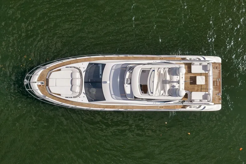 Slide: The Image of Aerial view of 2019 Azimut 55 yacht on green water. - 45