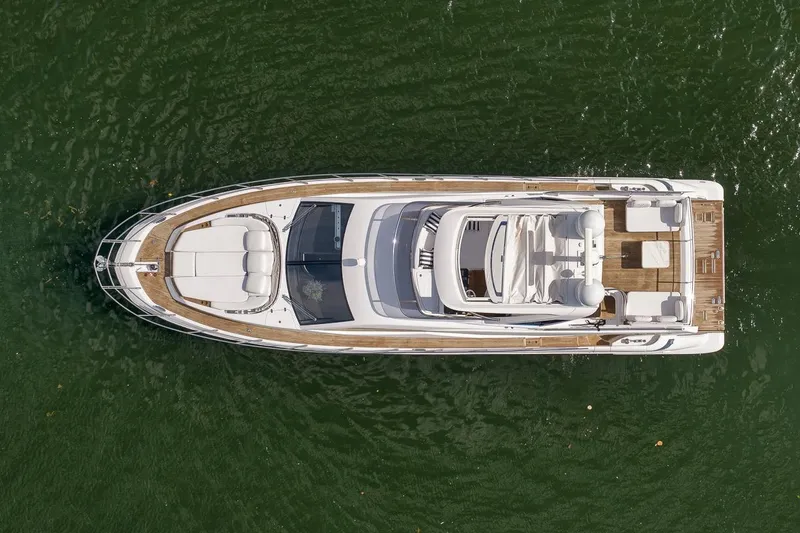 Slide: The Image of Aerial view of 2019 Azimut 55 yacht on green water. - 46