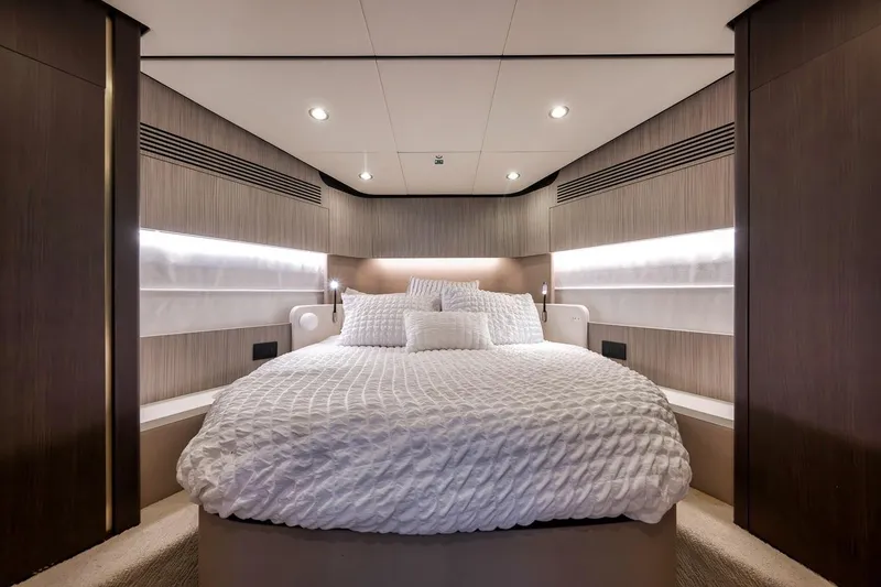 Slide: The Image of Luxurious bedroom interior of 2019 Azimut 55 yacht with elegant bedding and modern lighting. - 48