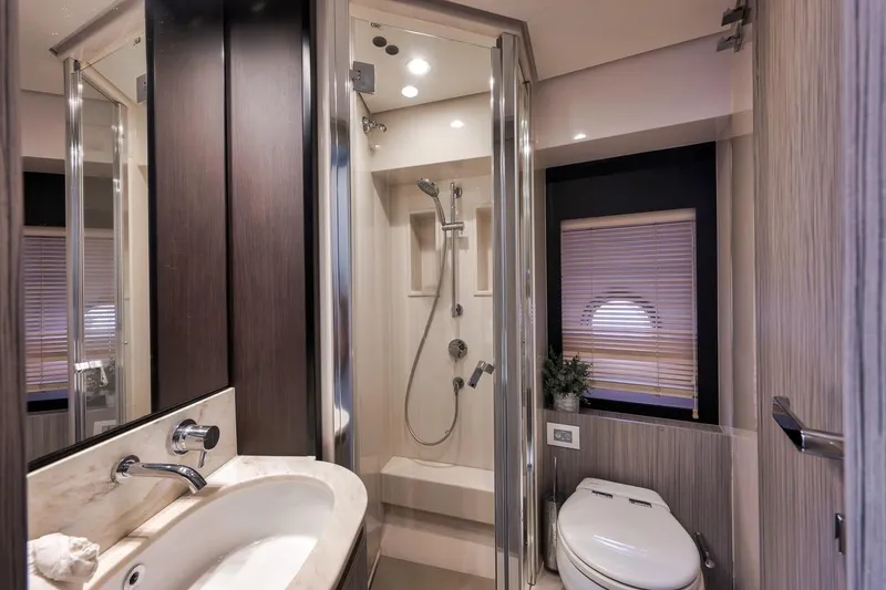 Slide: The Image of Luxurious bathroom interior on 2019 Azimut 55 yacht, featuring modern fixtures and elegant design. - 54