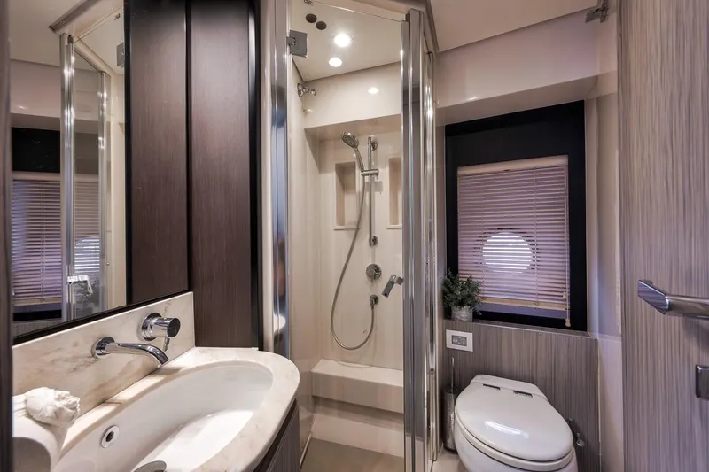 Slide: The Image of Luxurious bathroom in 2019 Azimut 55 yacht, featuring modern fixtures and elegant design. - 55