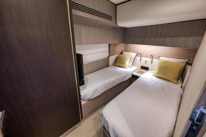 Slide: The Image of Luxurious twin cabin interior of 2019 Azimut 55 yacht with modern design and cozy bedding. - 58