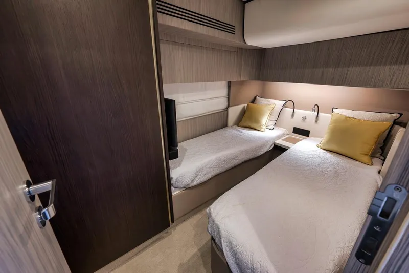 Slide: The Image of Luxurious twin cabin in 2019 Azimut 55 yacht with modern decor and cozy bedding. - 59