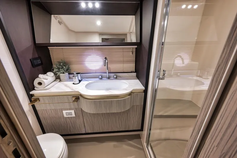 Slide: The Image of Luxurious bathroom interior of 2019 Azimut 55 yacht with modern fixtures and elegant design. - 63
