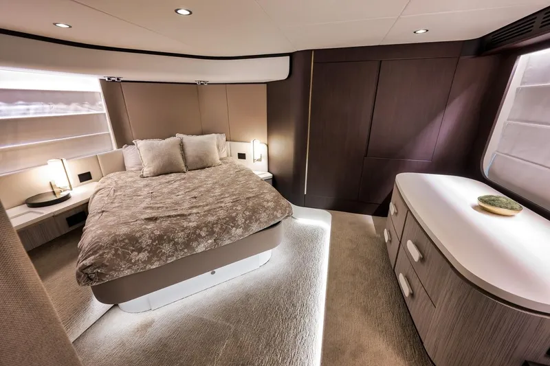 Slide: The Image of Luxurious bedroom interior of 2019 Azimut 55 yacht, featuring elegant design and modern furnishings. - 65