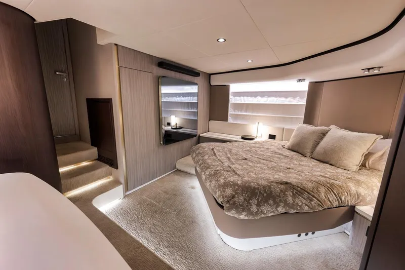 Slide: The Image of Luxurious bedroom interior of 2019 Azimut 55 yacht, featuring elegant design and cozy bedding. - 67