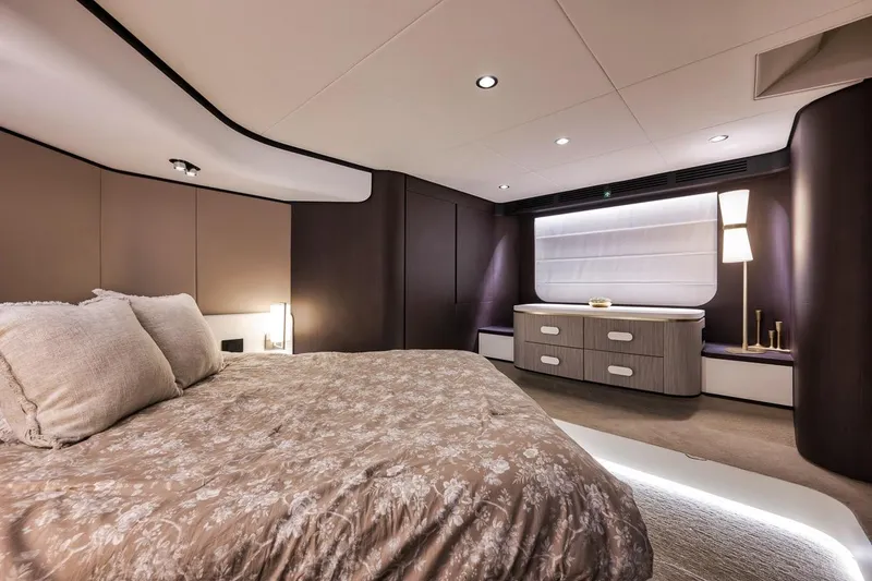 Slide: The Image of Luxurious bedroom interior of 2019 Azimut 55 yacht with elegant decor and ambient lighting. - 69