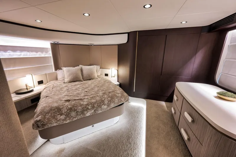 Slide: The Image of Luxurious bedroom interior of 2019 Azimut 55 yacht, featuring elegant design and modern furnishings. - 70