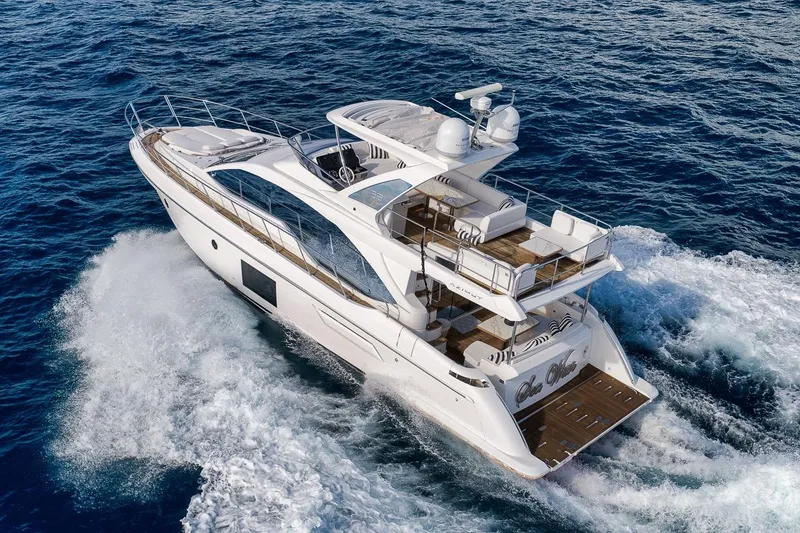 Slide: The Image of Luxurious 2019 Azimut 55 yacht cruising on open sea, showcasing elegant design and spacious deck. - 8