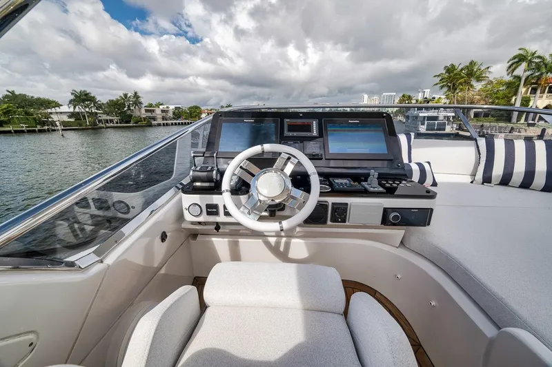 Slide: The Image of Cockpit of 2019 Azimut 55 yacht with modern navigation equipment and luxurious seating. - 80