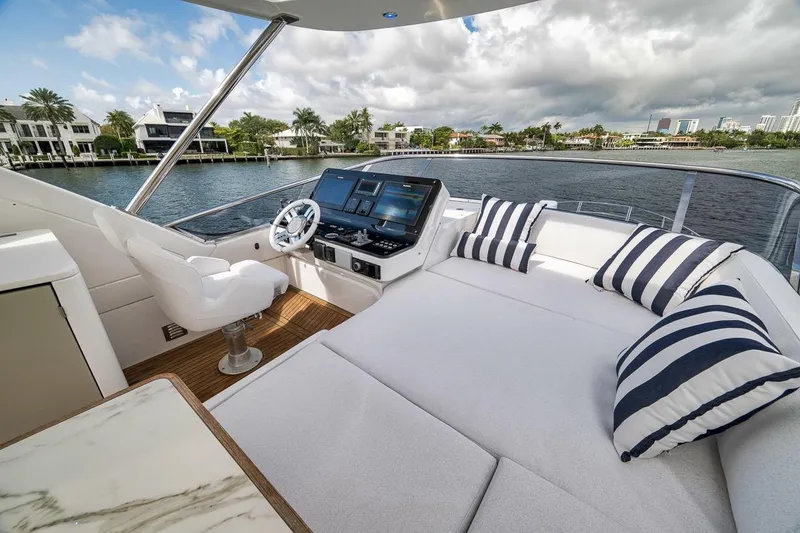 Slide: The Image of Luxurious 2019 Azimut 55 yacht interior with plush seating and modern navigation system. - 83