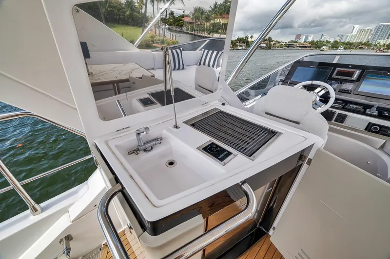 Slide: The Image of Luxurious 2019 Azimut 55 yacht interior with sink and grill on deck. - 86