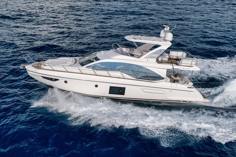 Slide: The Image of Luxurious 2019 Azimut 55 yacht cruising on open blue sea. - 9