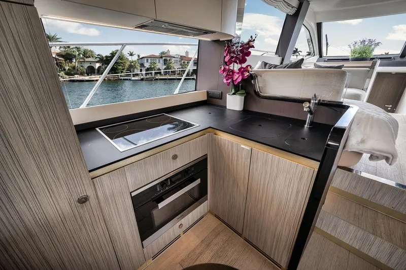 Slide: The Image of Luxurious kitchen interior of 2019 Azimut 55 yacht with modern appliances and waterfront view. - 95