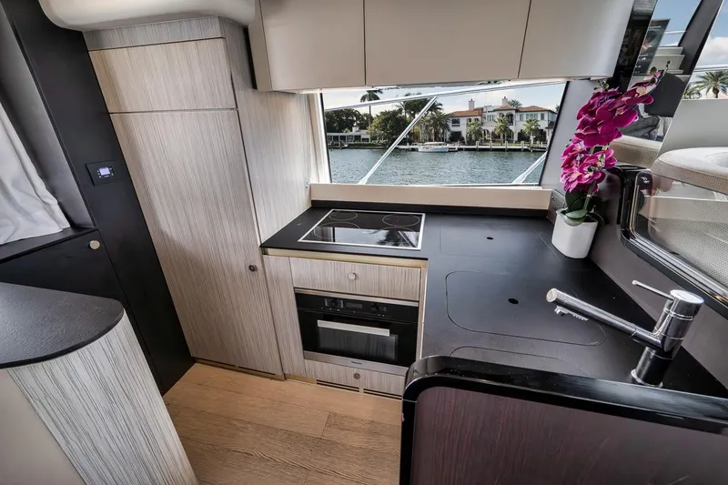 Slide: The Image of Modern kitchen interior of 2019 Azimut 55 yacht with sleek design and waterfront view. - 97