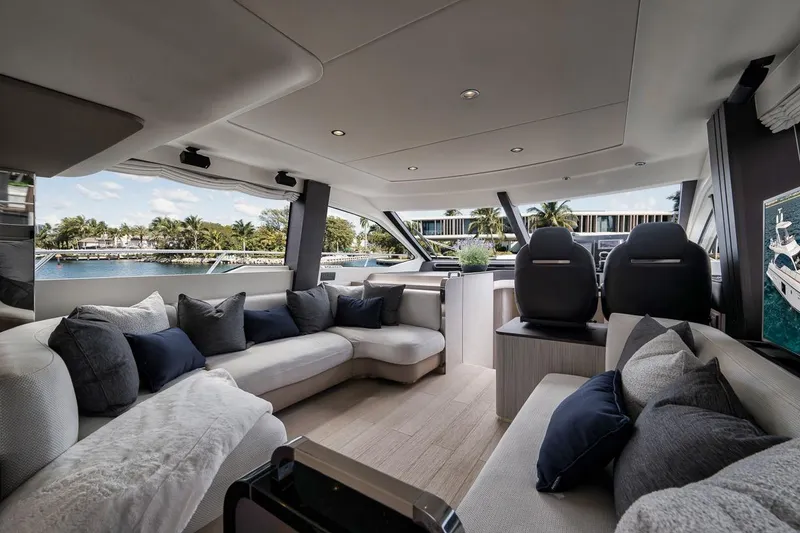 Slide: The Image of Luxurious interior of 2019 Azimut 55 yacht with plush seating and scenic water views. - 99