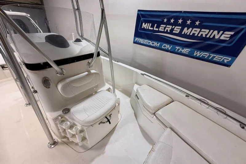 Slide: The Image of Interior of a 2011 Boston Whaler 230 Dauntless boat at Miller's Marine showroom. - 13