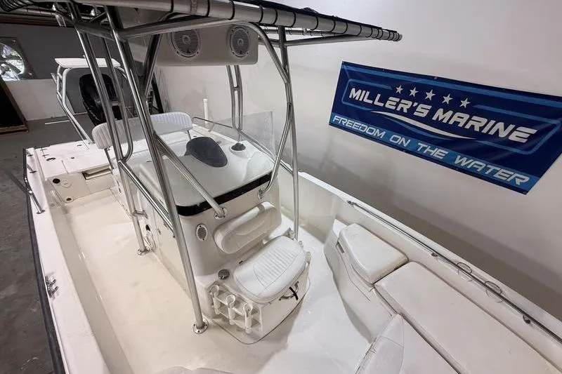 Slide: The Image of 2011 Boston Whaler 230 Dauntless boat interior at Miller's Marine showroom. - 14
