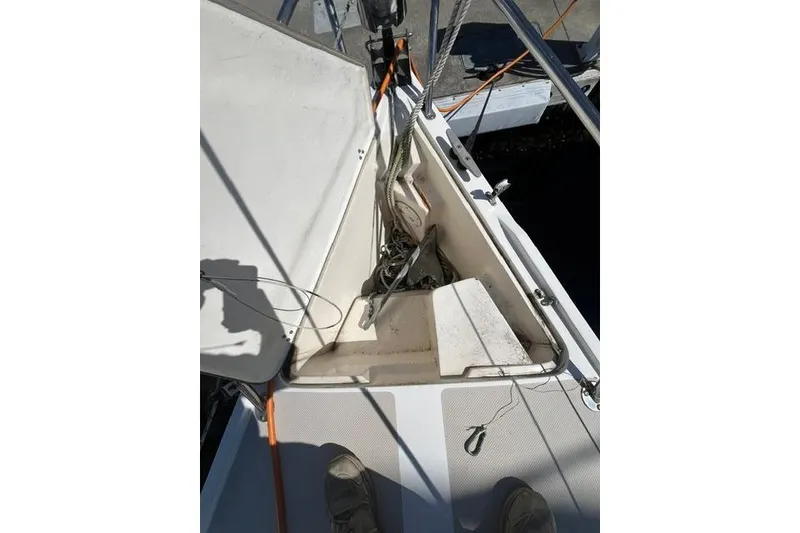 Slide: The Image of Anchor locker of a 1988 Catalina 30 sailboat with ropes and equipment. - 5