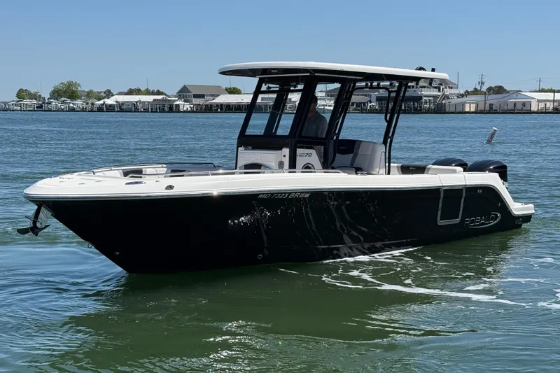 The Image of 2021 Robalo R272 Center Console boat on calm water, showcasing sleek design. - 0