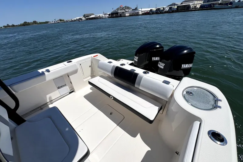 Slide: The Image of 2021 Robalo R272 Center Console boat with Yamaha engines on calm water. - 14