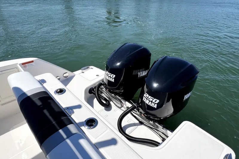 Slide: The Image of 2021 Robalo R272 Center Console with twin Yamaha 250 engines on water. - 15