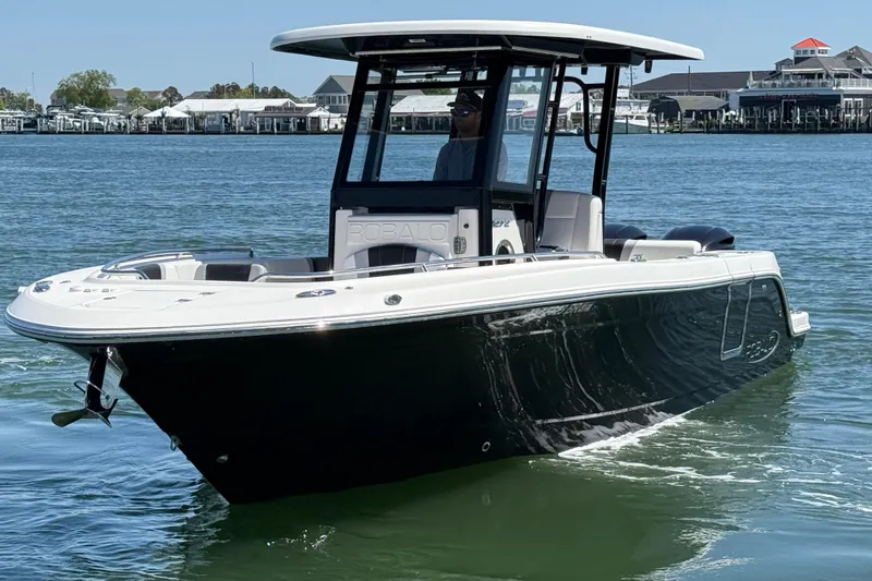 Slide: The Image of 2021 Robalo R272 Center Console boat on water, showcasing sleek design and modern features. - 9