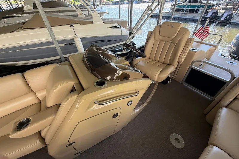 Slide: The Image of Luxurious interior of a 2011 Bennington 2575QCW OB pontoon boat with plush seating. - 15