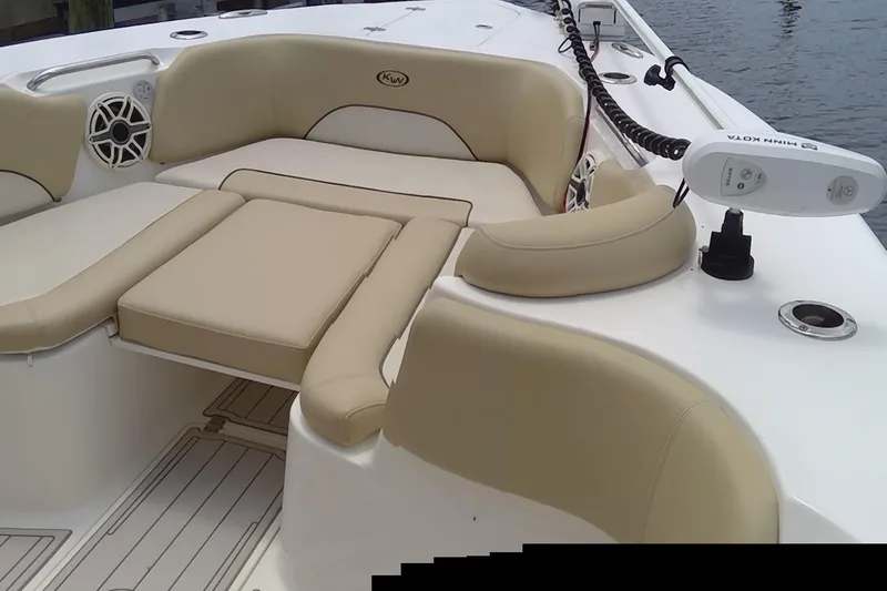 Slide: The Image of 2020 Key West 263 FS boat covered with a protective tarp at a dock. - 15
