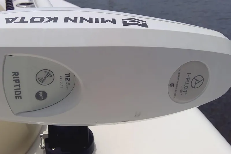 Slide: The Image of 2020 Key West 263 FS boat docked near waterfront homes. - 16