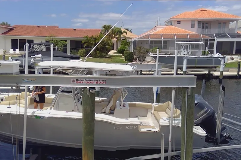 Slide: The Image of 2020 Key West 263 FS boat console with cup holder and branding. - 23