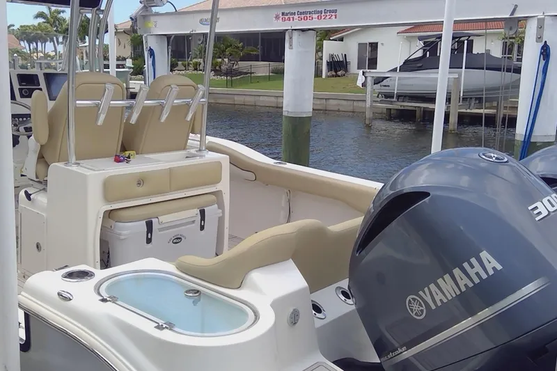 Slide: The Image of 2020 Key West 263 FS boat seats, beige and white upholstery, dual seating arrangement. - 24