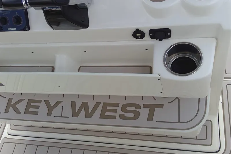 Slide: The Image of 2020 Key West 263 FS boat interior with beige seating and modern design. - 30