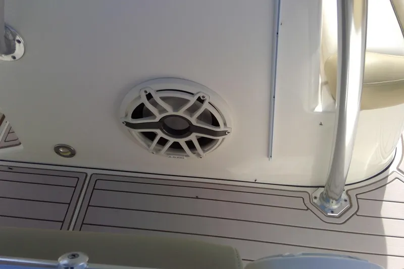 Slide: The Image of 2020 Key West 263 FS boat interior with speaker and sleek flooring design. - 32
