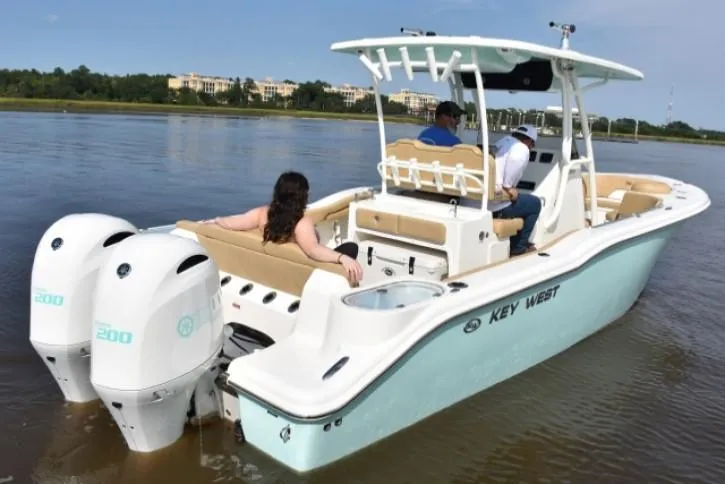 Slide: The Image of Luxurious seating area on a 2020 Key West 263 FS boat with beige upholstery. - 4