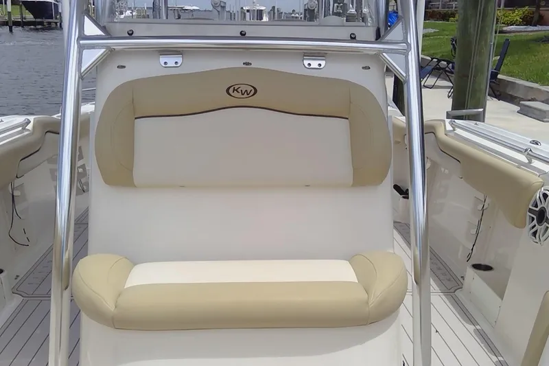 Slide: The Image of 2020 Key West 263 FS boat interior with beige seating and stainless steel frame. - 5