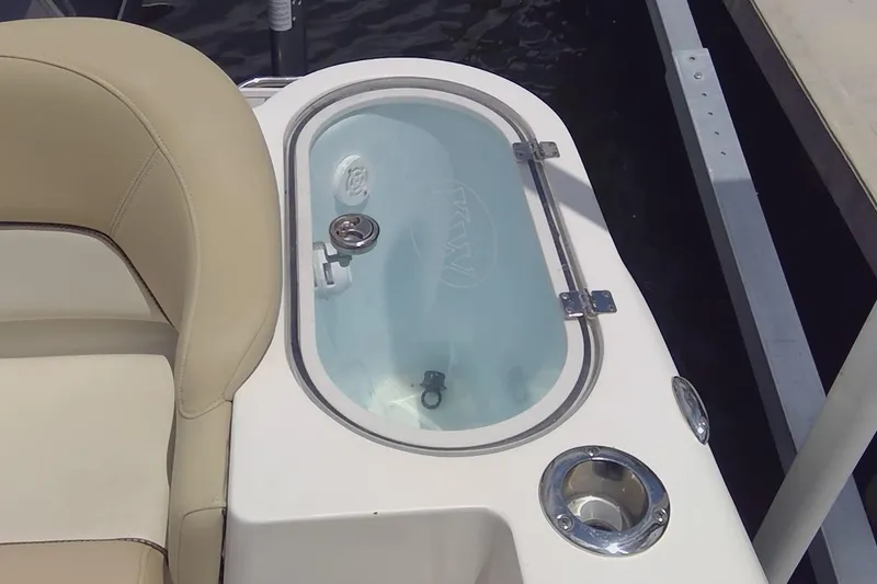 Slide: The Image of Outboard motor of 2020 Key West 263 FS boat docked by water. - 7