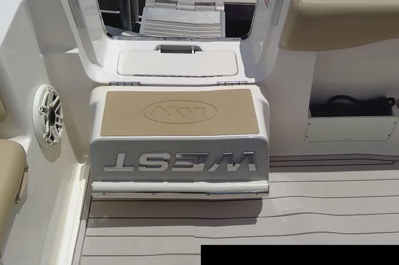 Slide: The Image of 2020 Key West 263 FS boat dashboard with Garmin device and control panel. - 8